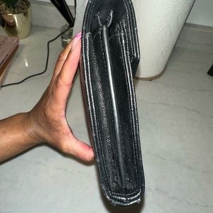 Black and gold YSL clutch worn once